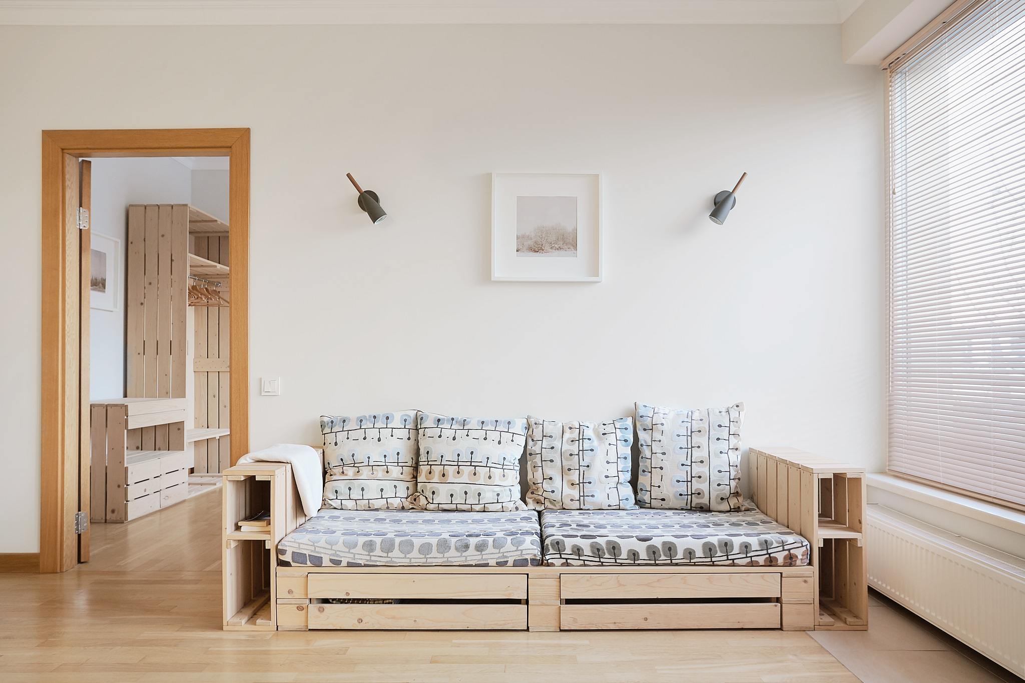 Wooden palette like design in Riga center apartment to rent.