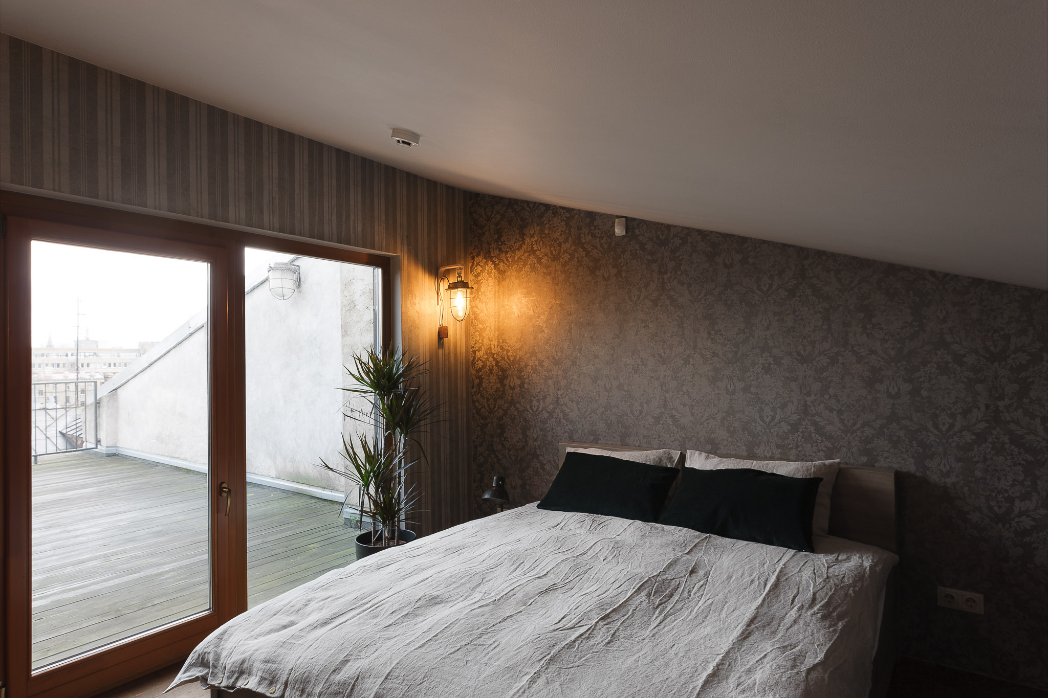 Bedroom picture with view on a terrasse in Riga city.